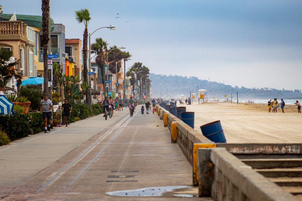 People Walking on the sidewalk near Mission Beach, San Diego